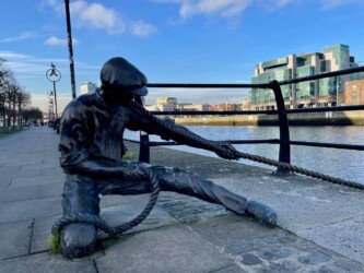 Ireland, Dublin - The Linesman statue at the bank of Liffey